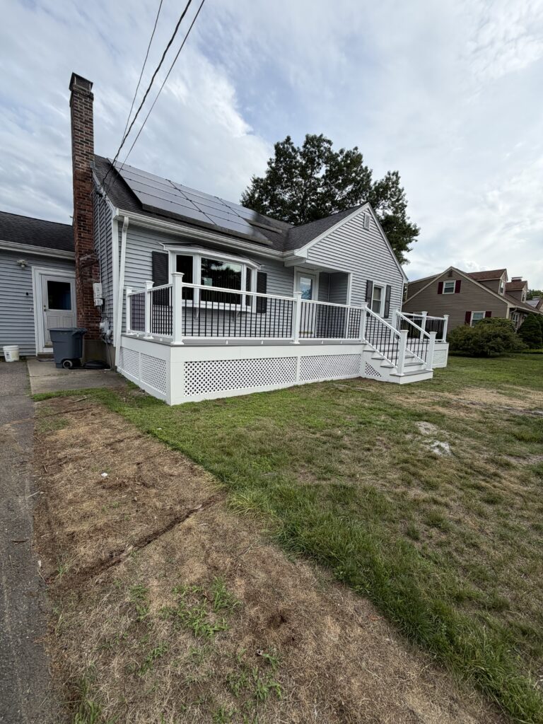Deck and porch addition on a Massachusetts home by J&J All Seasons Corp